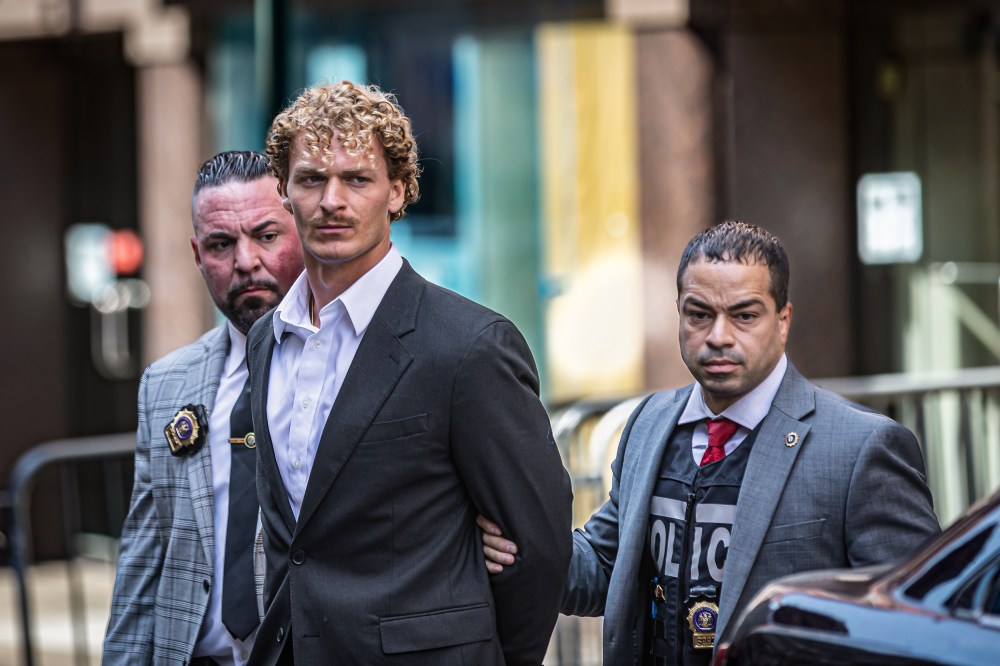 US Marine veteran Daniel Penny, 24, is escorted in handcuffs