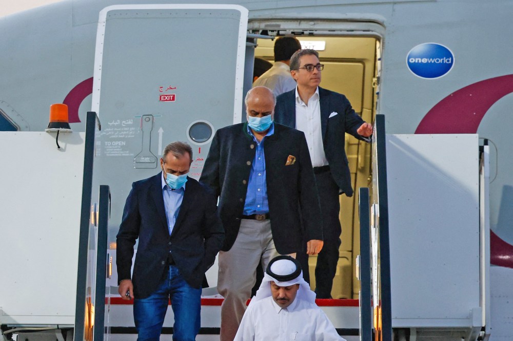 U.S. citizens Emad Sharqi, left, and Morad Tahbaz and Siamak Namazi disembark from a Qatari jet upon their arrival at the Doha International Airport on Sept.18, 2023.