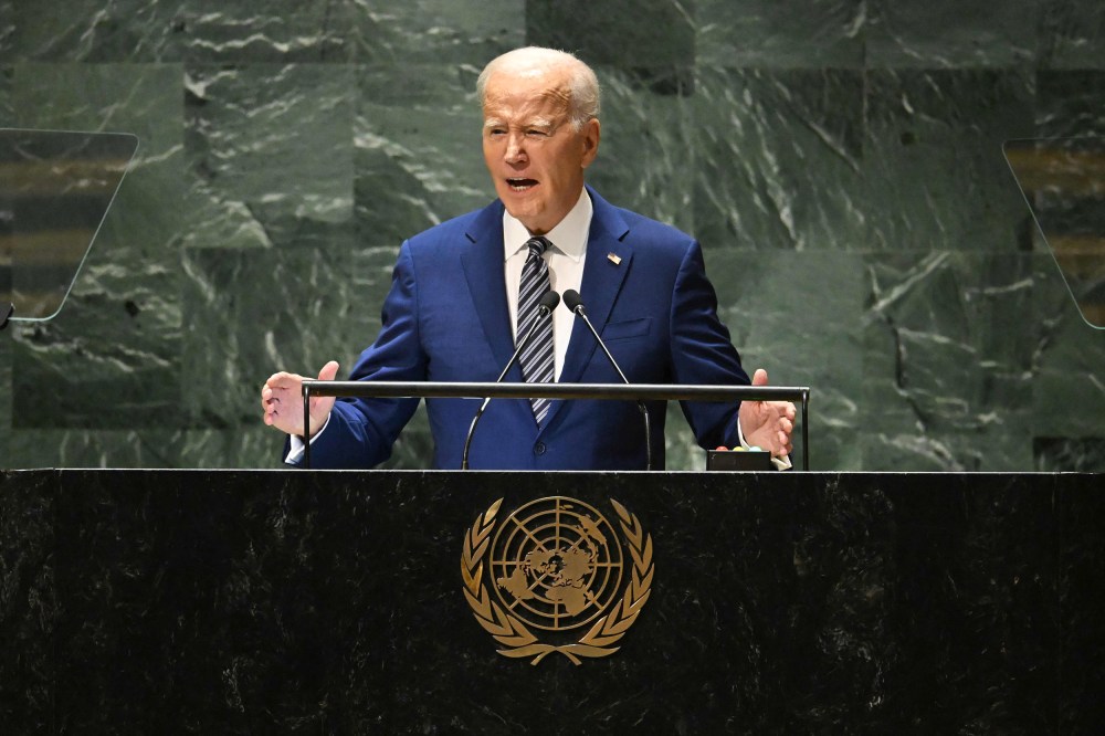 Joe Biden speaks at a podium with the United Nations logo in the front