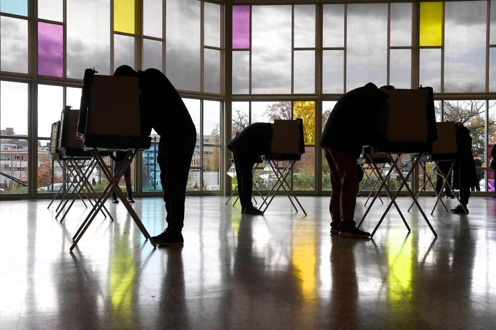 Voters mark their ballots at First Presbyterian Church in Stamford, Conn.
