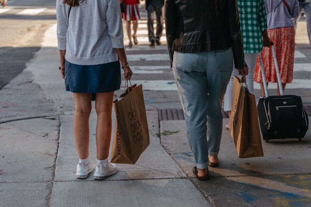 Shoppers carry Bloomingdale's bags in the Magnificent Mile shopping district in Chicago