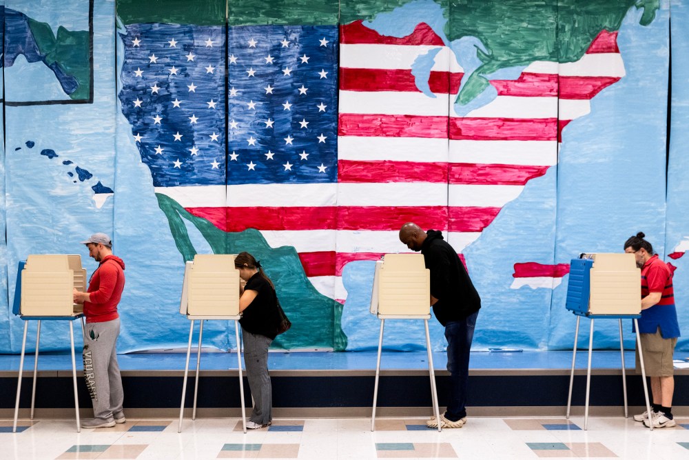 Voters fill out their ballots at a polling station in Midlothian, Va. on Nov. 7, 2023.