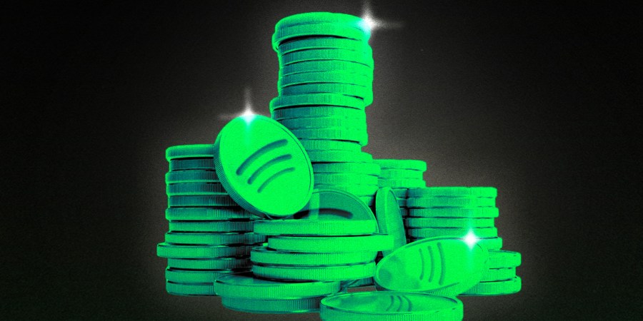 A stack of coins embossed with the Spotify logo