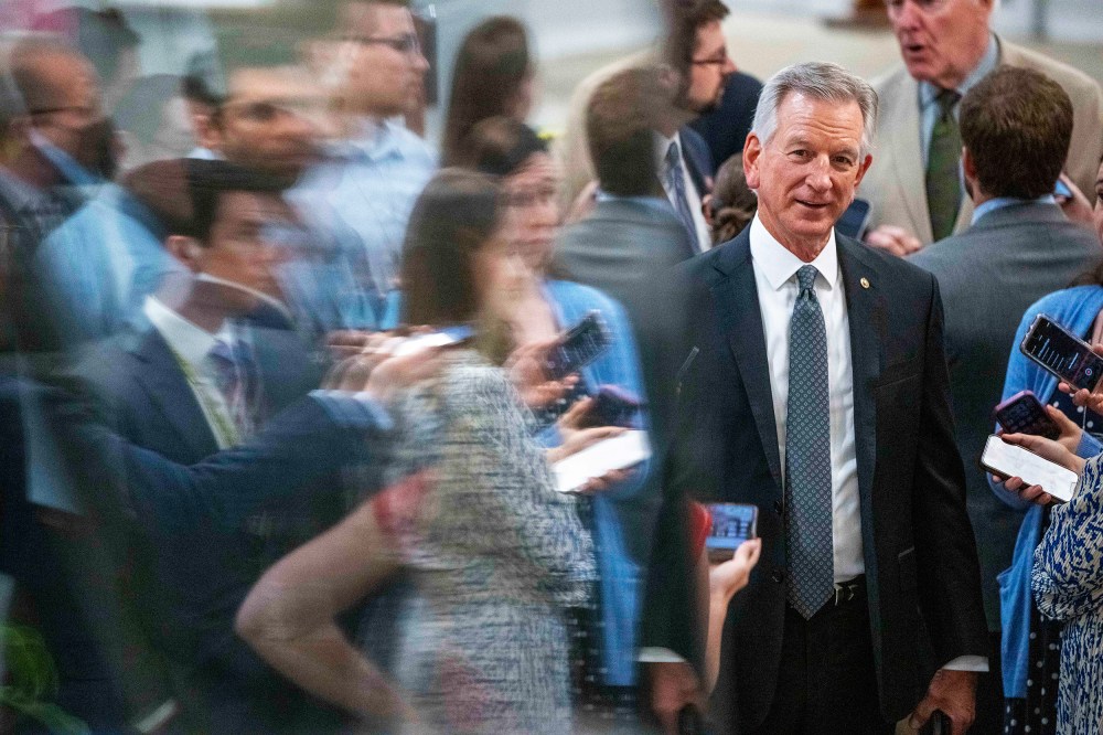 Sen. Tommy Tuberville, R-Ala., talks with reporters as he walks to a vote on Capitol Hill
