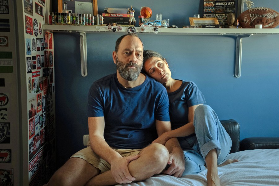 Jon Polin and Rachel  Goldberg-Polin, parents of Hersh, sit in his bedroom in Jerusalem on Oct. 26, 2023. 