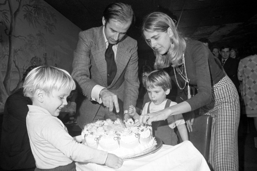 BIden and his wife cut a birthday cake.