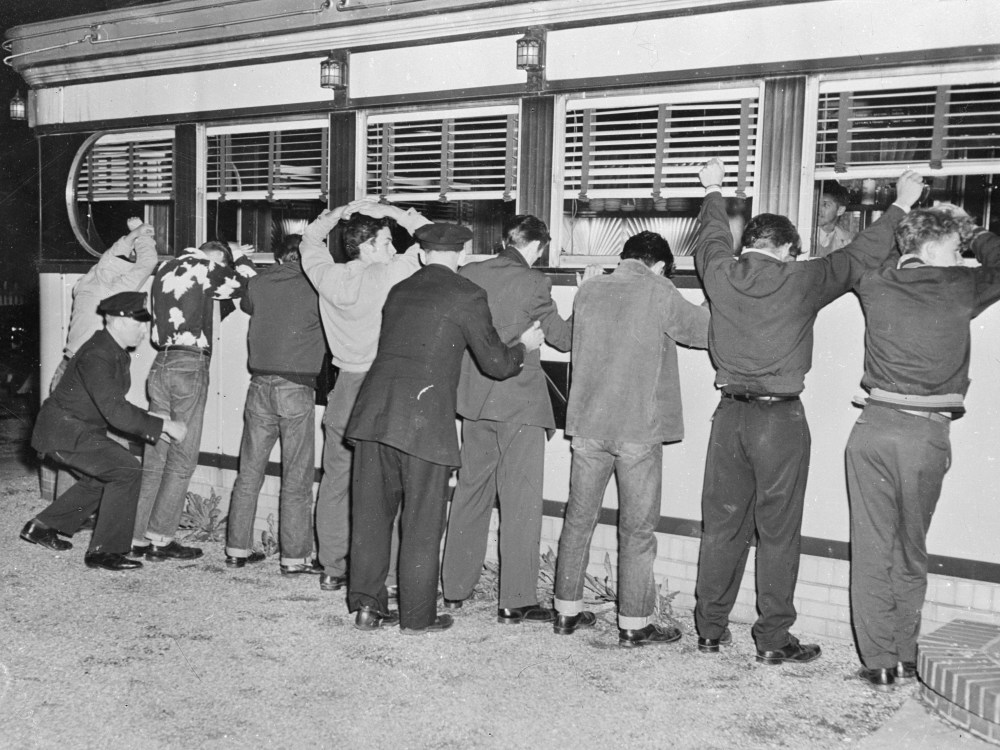 File Photo: 28th May 1951:  New York Police frisking youths after fighting erupted between rival gangs in Queens' Village.  (Photo by Keystone/Getty Images/File)
