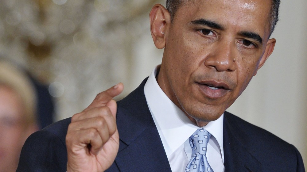 US President Barack Obama speaks before signing a memorandum on reducing the burden of student loans on June 9, 2014 in the East Room of the White House in Washington, DC.