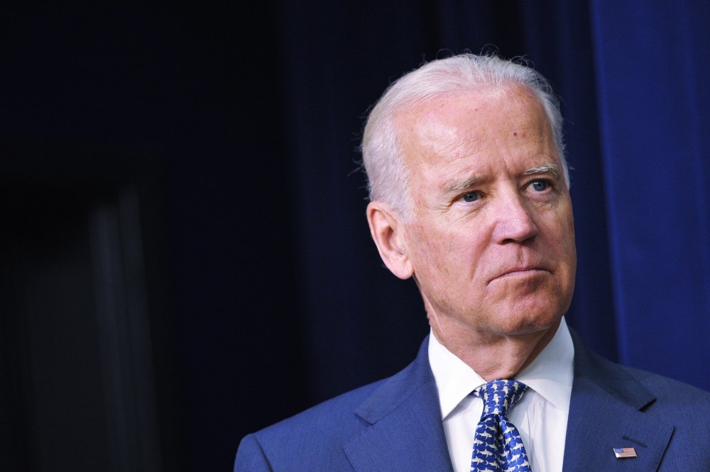 Vice President Joe Biden watches as President Barack Obama speaks during an event at the Eisenhower Executive Office Building on June 10, 2014 in Washington, D.C. (Photo by Mandel Ngan/AFP/Getty)