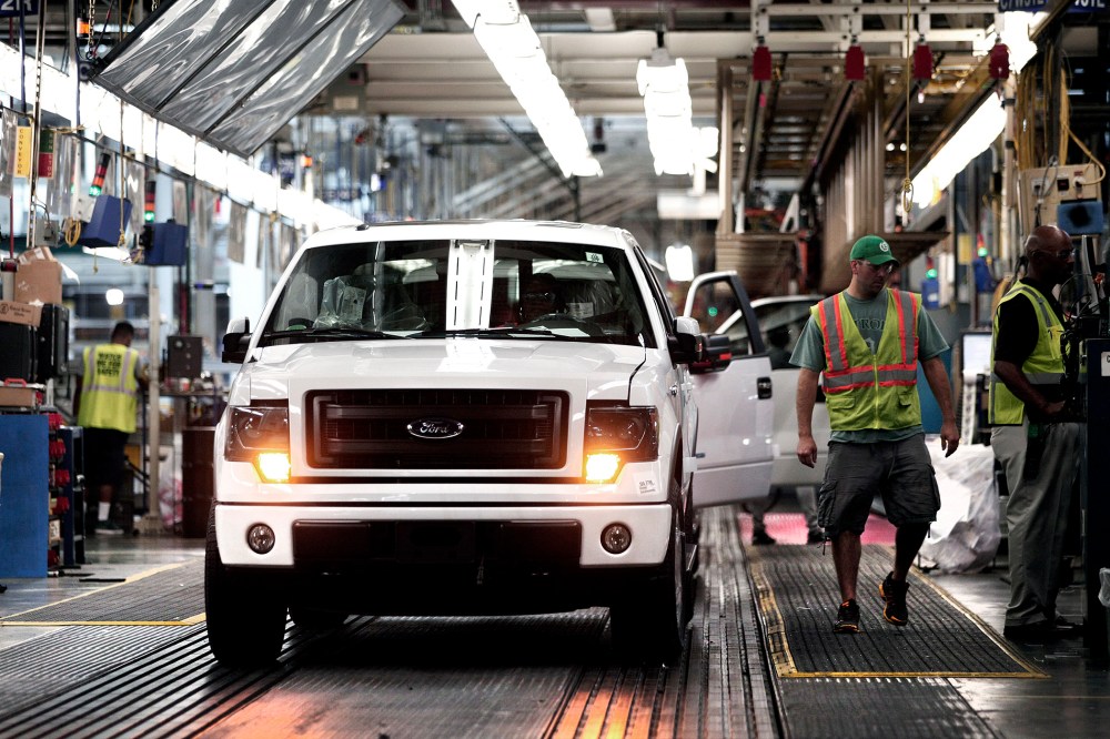 Ford F-150 trucks are prepared to come off the assembly line at the Ford Dearborn Truck Plant on June 13, 2014 in Dearborn, Mich.