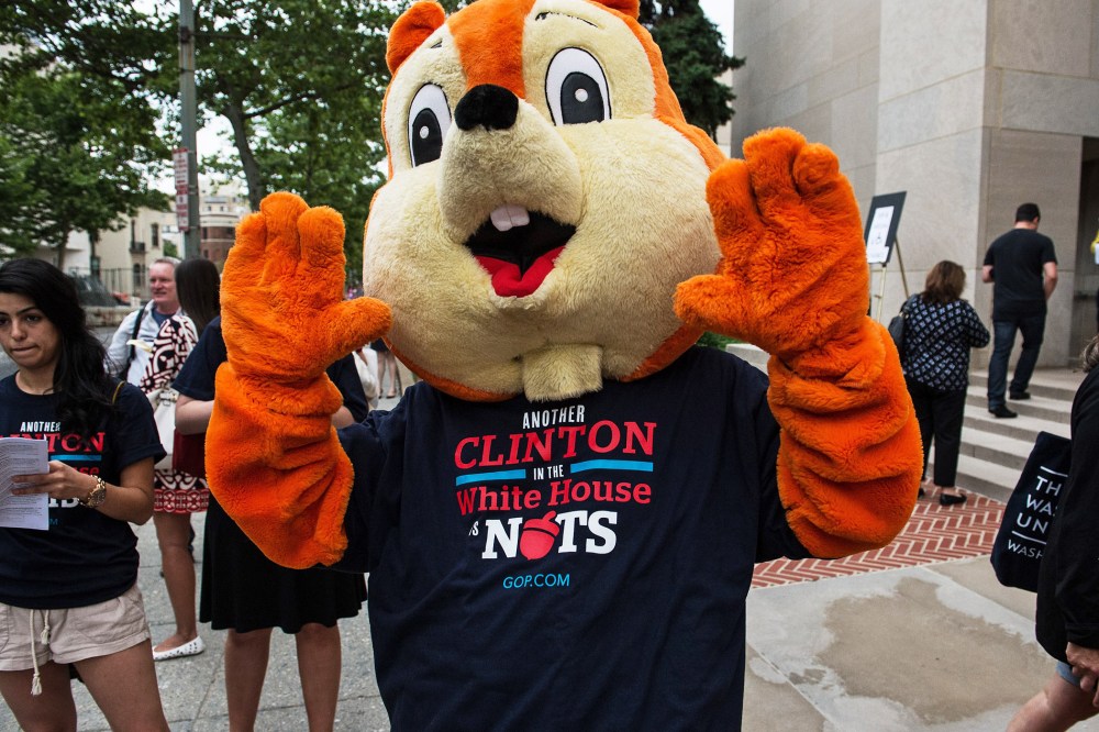 Opponents of Hillary Clinton stand outside Lisner Auditorium at GWU before Clinton speaks about her new book in Washington, June 13, 2014.