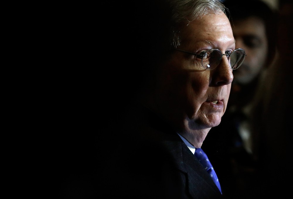 Senate Minority Leader Mitch McConnell (R-KY) speaks to reporters following the weekly policy lunch of the Republican caucus on Nov. 19, 2013 in Washington, D.C.