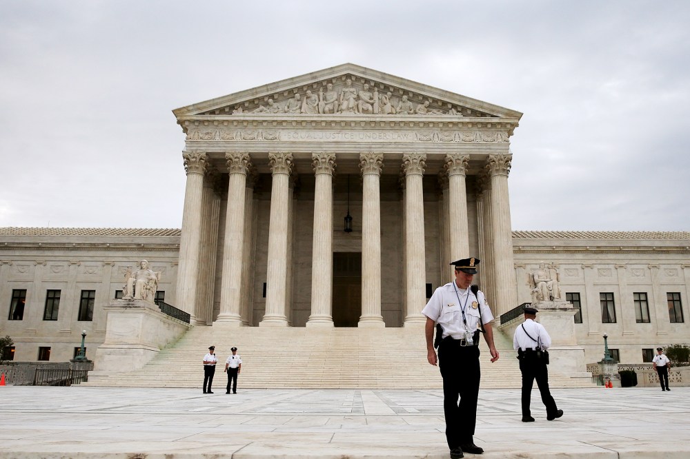 Police stand in front of the U.S. Supreme Court on June 30, 2014 in Washington, DC.