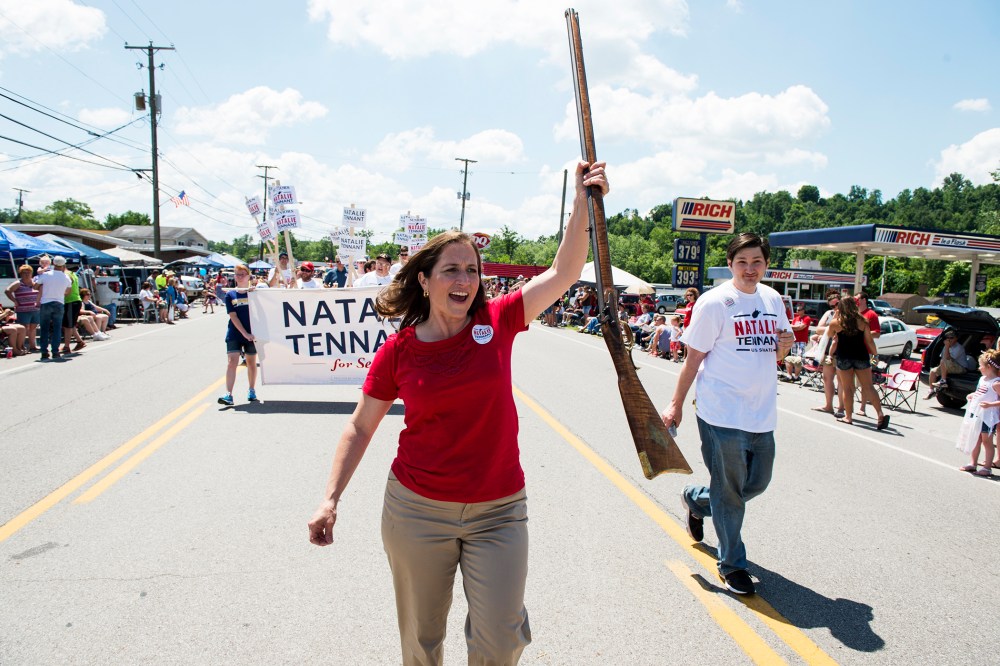 U.S. Senate candidate West Virginia Secretary of State Natalie Tennant marches with her musket in the Ripley 4th of July Parade in Ripley, W. Va., on July 4, 2014.