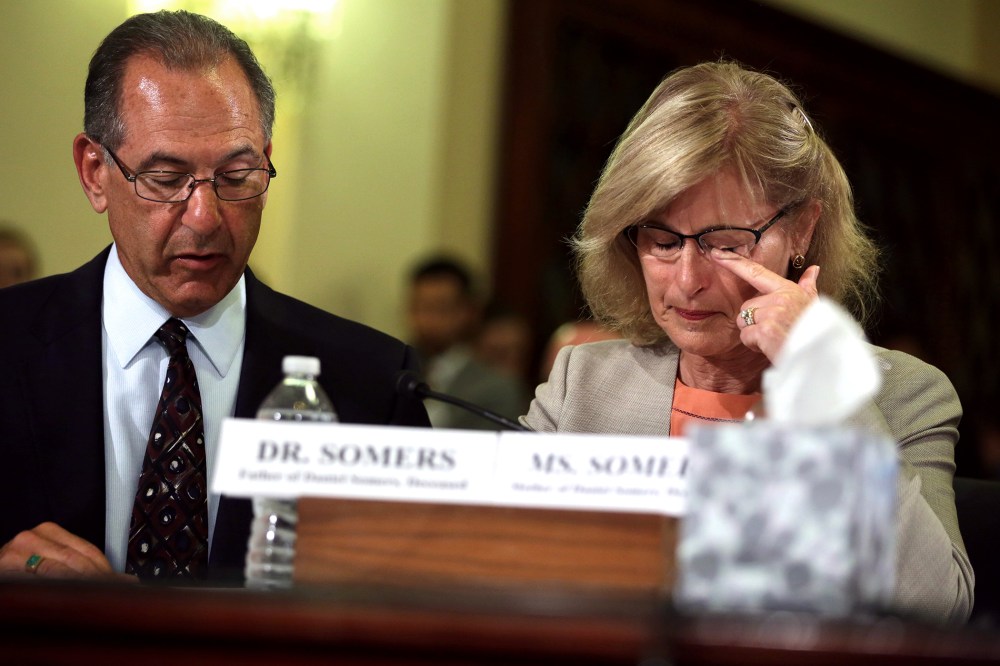 Jean Somers (R), whose son Daniel took his own life after he returned from a second deployment in Iraq, wipes tears during a hearing on Capitol Hill in Washington, DC.