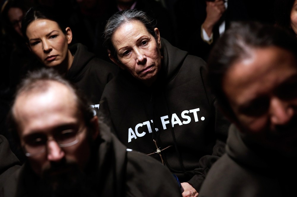 Supporters of immigration reform listen during a Fast for Families press conference in Washington, DC., Nov. 26, 2013.