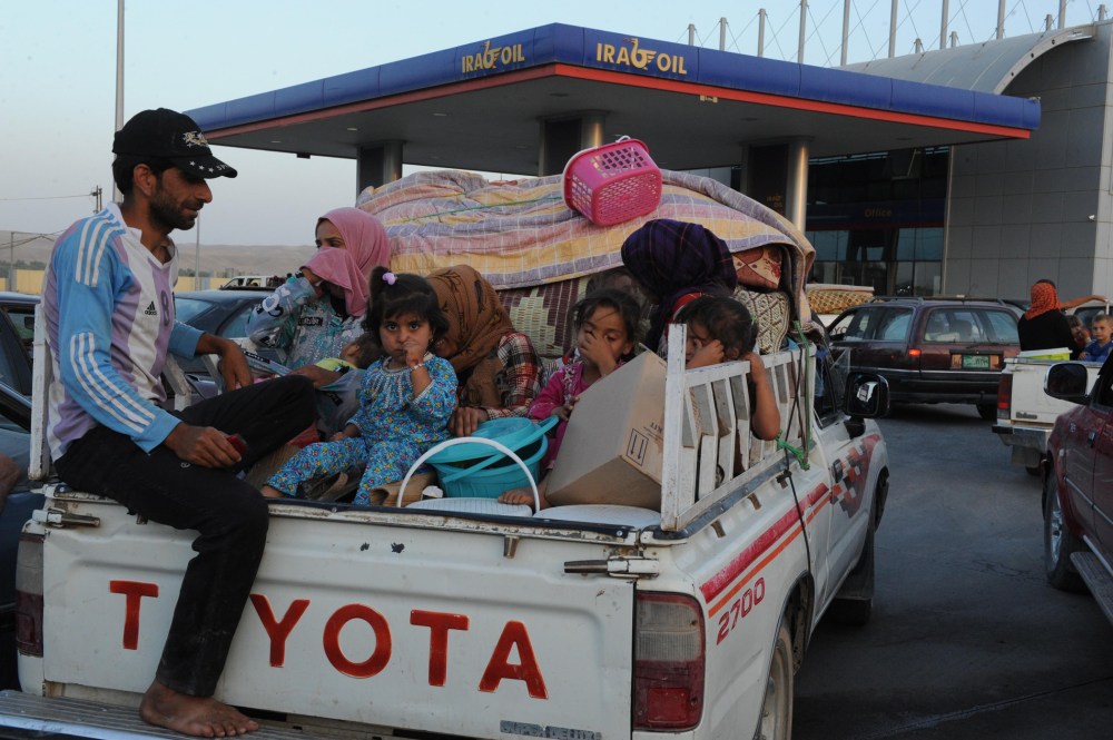 Thousands of Yazidi and Christian people flee Mosul to Erbil after the latest wave of ISIL advances that began on Sunday has seen a number of towns near Iraq's second largest city fall to the militants on August 6, 2014.