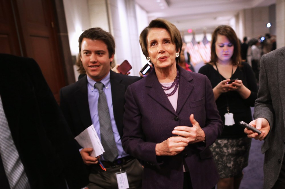 House Minority Leader Nancy Pelosi talks with reporters, Dec. 5, 2013.