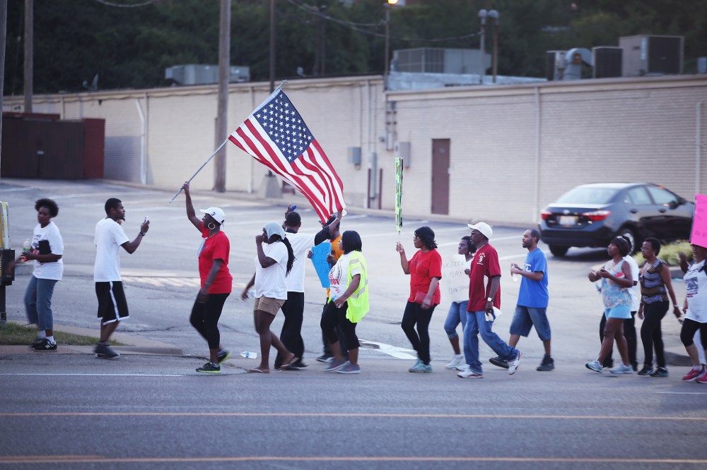 Demonstrators protest the death of Michael Brown on August 22, 2014 in Ferguson, Missouri.
