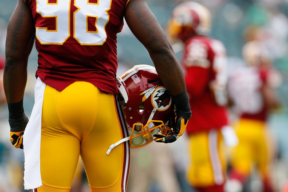 A Washington Redskins helmet is carried by Brian Orakpo #98 of the Washington Redskins before the game against the Philadelphia Eagles on Sept. 21, 2014 in Philadelphia.