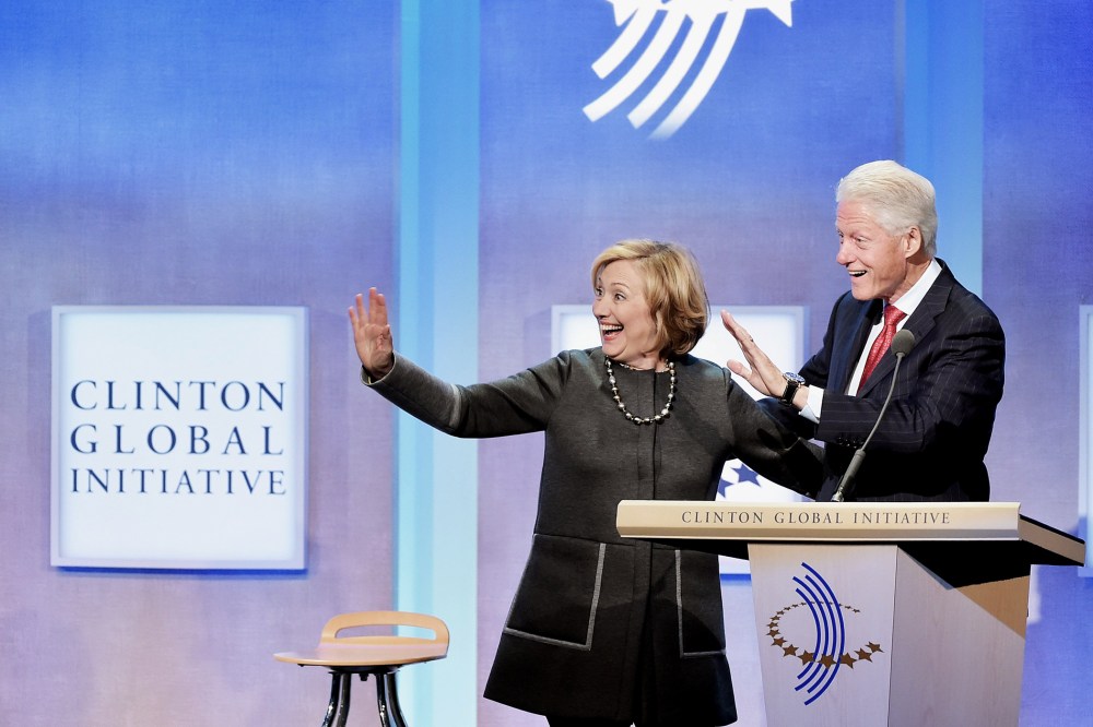 Former US Secretary of State Hillary Clinton and husband, Former U.S. President Bill Clinton address the audience during a meeting for the  Clinton Global Initiative on Sept. 22, 2014 in New York City.