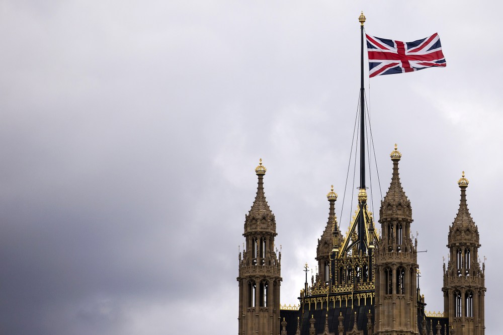 The Union flag flying above the Houses of Parliament where lawmakers are expected to vote in favour of joining air strikes against Islamic State (IS) militants in central London on 26 September, 2014. Photo by Justin Tallis/Getty.