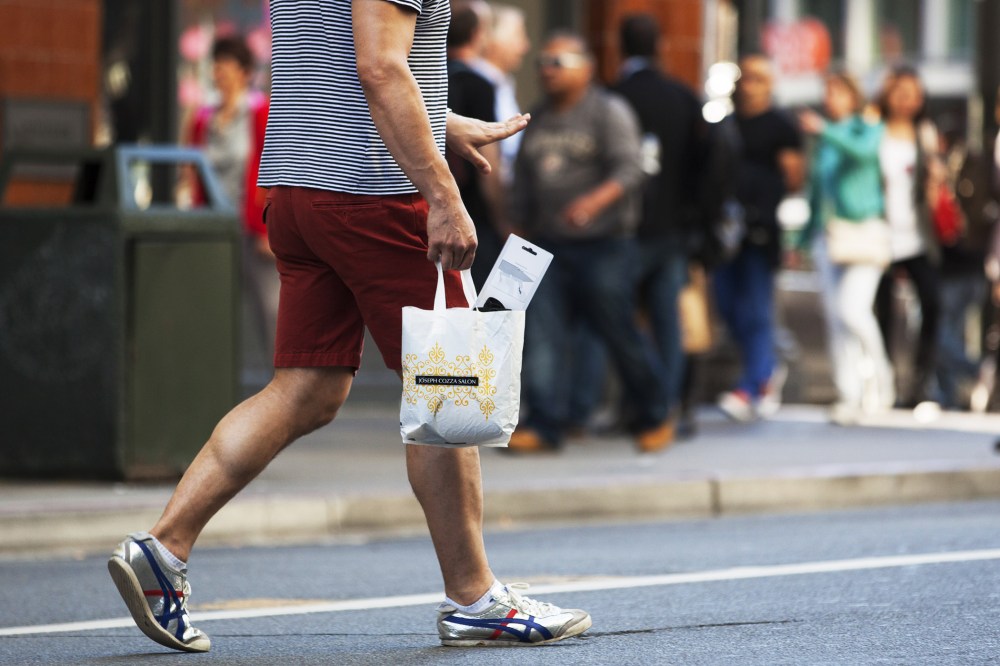 A man carries a plastic shopping bag on September 30, 2014  in San Francisco, California.