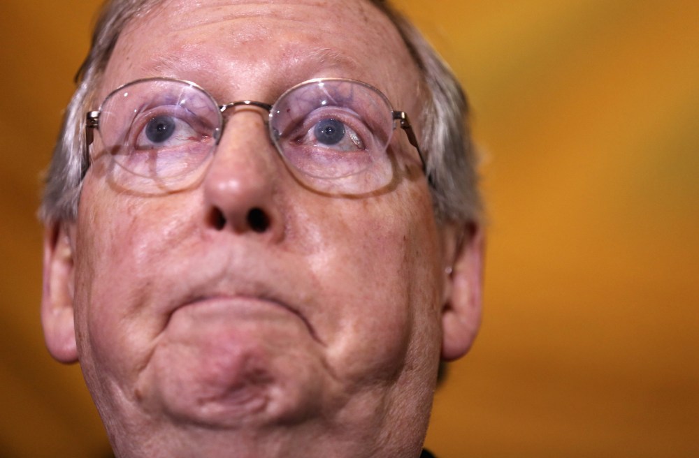 Senate Minority Leader Sen. Mitch McConnell (R-KY) pauses during a media briefing on December 17, 2013 on Capitol Hill in Washington, D.C.