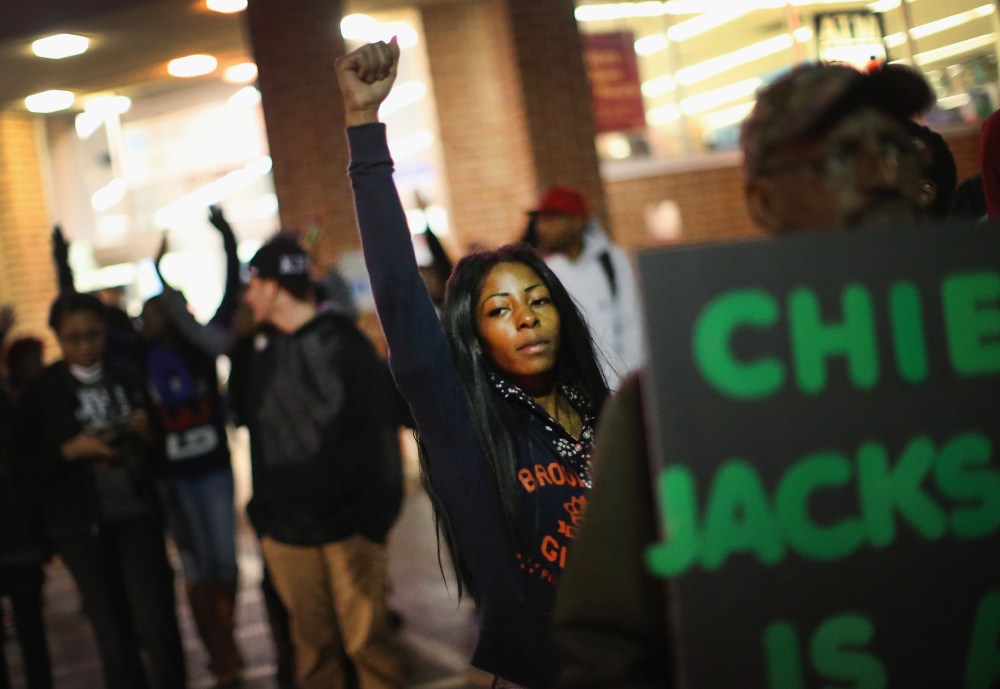 Demonstrators face off with police as protests continue in the wake of 18-year-old Michael Brown's death on Oct. 22, 2014 in Ferguson, Mo.