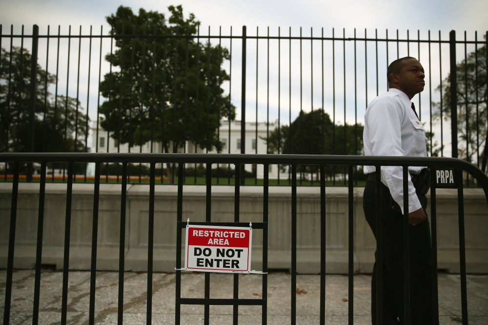 A member of the US Secret Service stands guard in front of White House Oct. 23, 2014 in Washington, DC.
