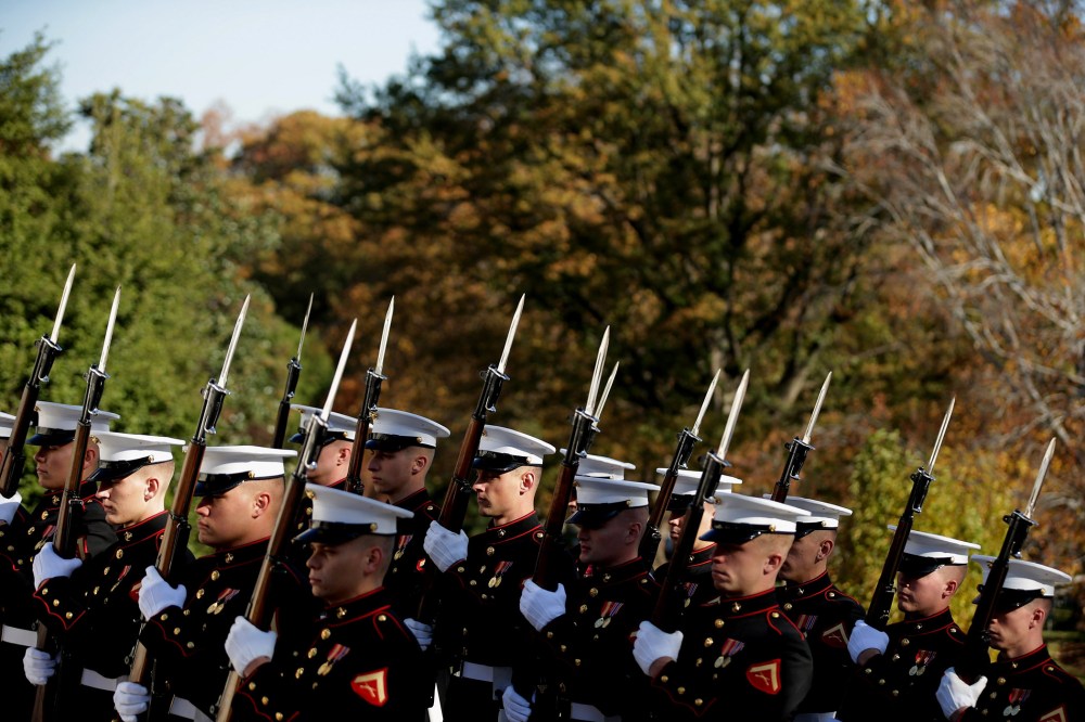 Honor guards for all branches of the U.S. military arrive for a wreath laying ceremony at The Tomb of the Unknowns on Nov. 11, 2014 in Arlington, Va.