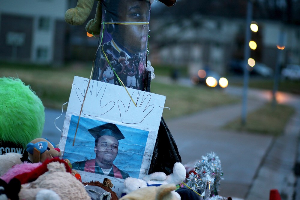 A photo of 18-year-old Michael Brown sits on a memorial on Nov. 22, 2014 in Ferguson, Mo. (Photo by Justin Sullivan/Getty)