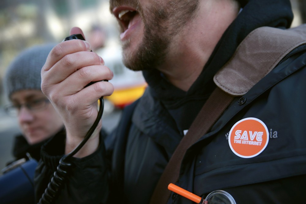 An activist speaks during a rally outside the headquarters of the Federal Communications Commission on Dec. 11, 2014 in Washington, DC. (Alex Wong/Getty)