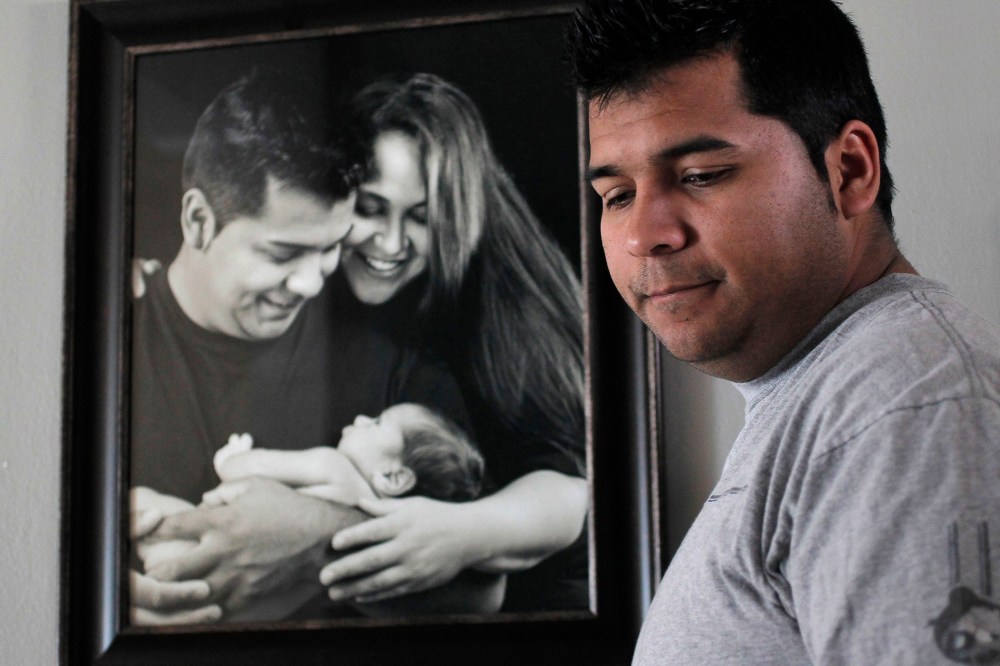 Erick Munoz, the husband of Marlise Machado Munoz, poses for a photo at his home on Jan. 3, 2014.
