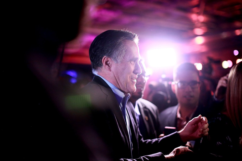 Mitt Romney is greeted by fellow Republicans at a dinner during the Republican National Committee's Annual Winter Meeting aboard the USS Midway on Jan. 16, 2015 in San Diego, Calif.