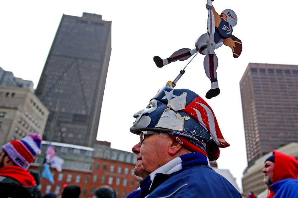 Fans attend the New England Patriots Send-Off Rally at City Hall Plaza on Jan. 26, 2015 in Boston, Massachusetts. The Patriots will face the Seattle Seahawks in Superbowl XLIX on Sunday. (Photo by Maddie Meyer/Getty)