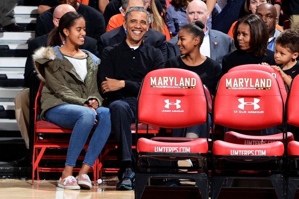 President Obama and his family watch a college basketball game between the Oregon State Beavers and the Maryland Terrapins, Nov. 17, 2013.