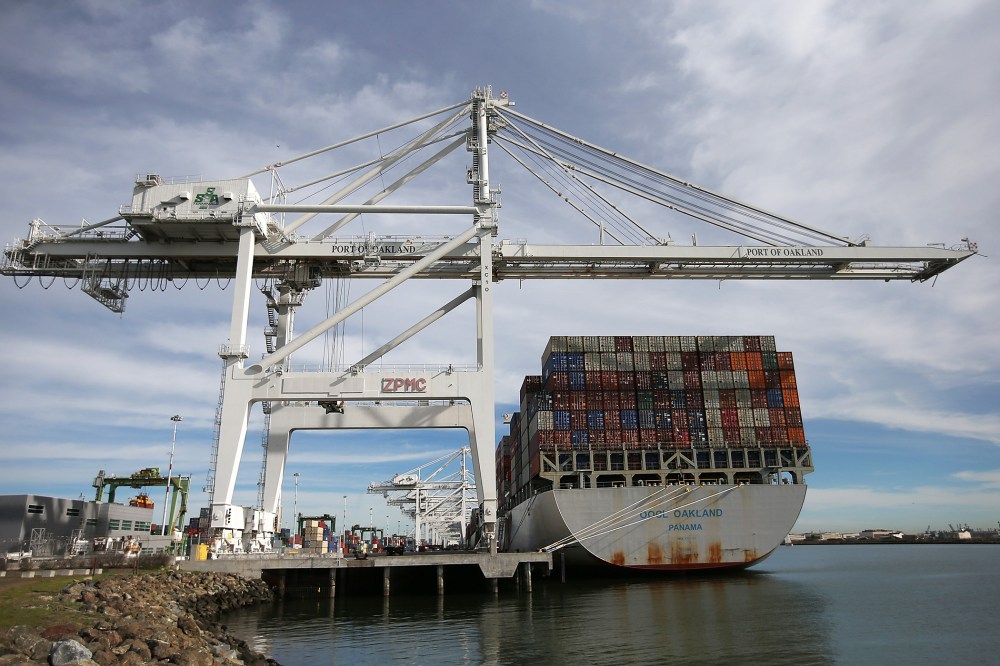 A container ship sits docked in a berth at the Port of Oakland on Feb. 11, 2015 in Oakland, Calif. (Photo by Justin Sullivan/Getty)