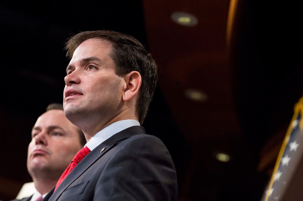 Sen. Marco Rubio (R-FL) speaks next to Sen. Mike Lee (R-Utah) during a news conference to introduce their proposal for an overhaul of the tax code, March 4, 2015 on Capitol Hill in Washington, DC. (Photo by Drew Angerer/Getty)