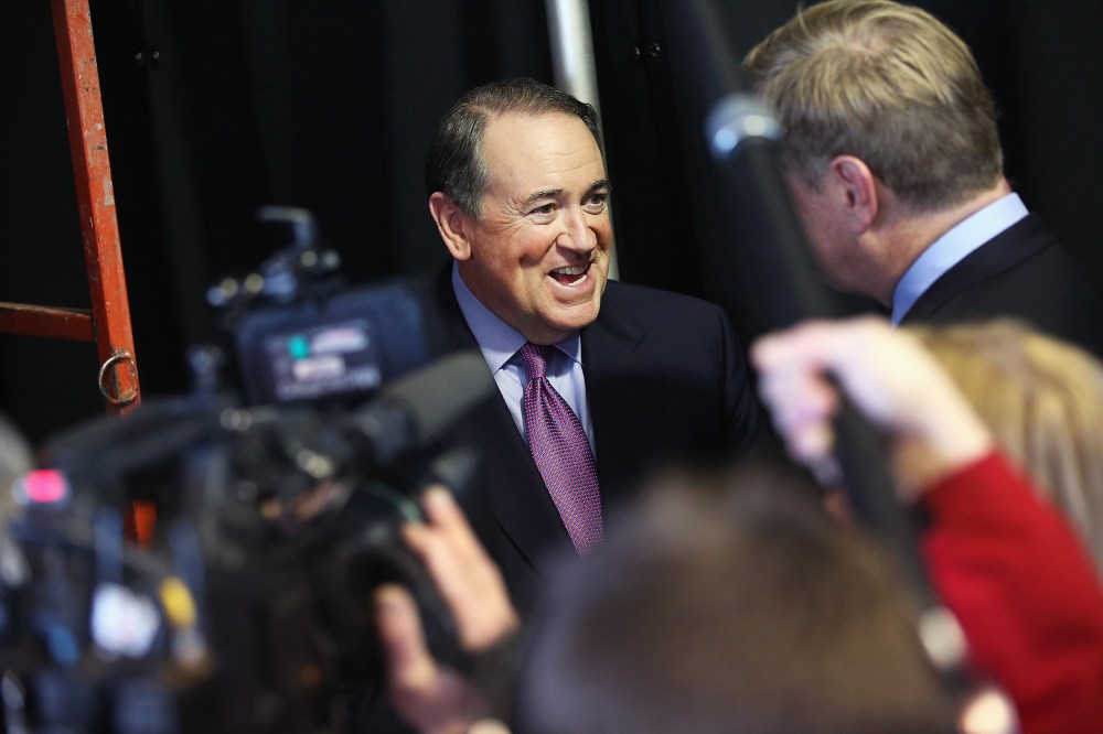 Former Governor Mike Huckabee of Arkansas fields questions from reporters at the Iowa Ag Summit on March 7, 2015 in Des Moines, Iowa. (Photo by Scott Olson/Getty)