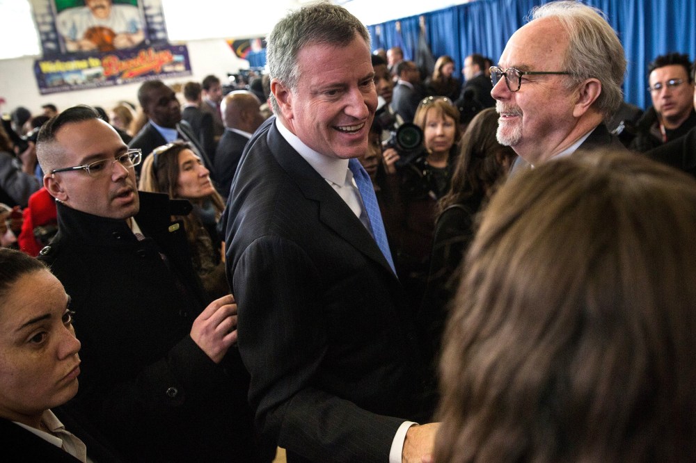 New York City Mayor Bill De Blasio (C) greets supporters after a press conference in Brownsville, Brooklyn, NY on Jan. 30, 2014.