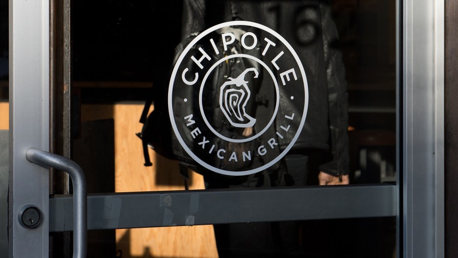 A man walks into a Chipotle restaurant in Washington DC on Jan. 31, 2014.