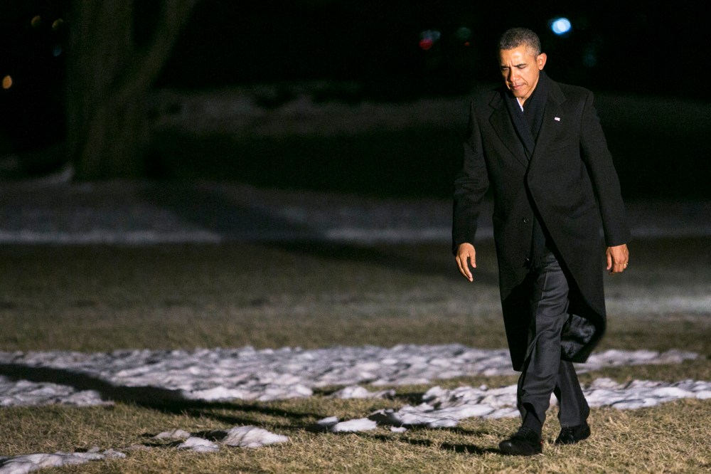 U.S. President Barack Obama walks across the South Lawn of the White House on February 17, 2014.