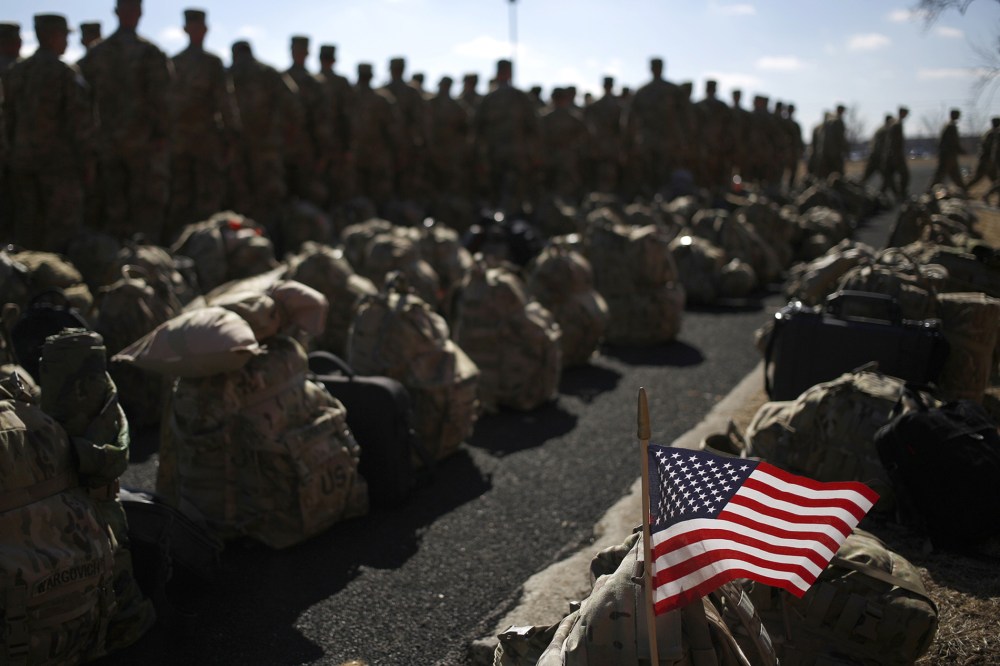 An American flag flies from the rucksack of soldier outside a homecoming ceremony on Fort Knox, Feb. 27, 2014 in Fort Knox, Ky.