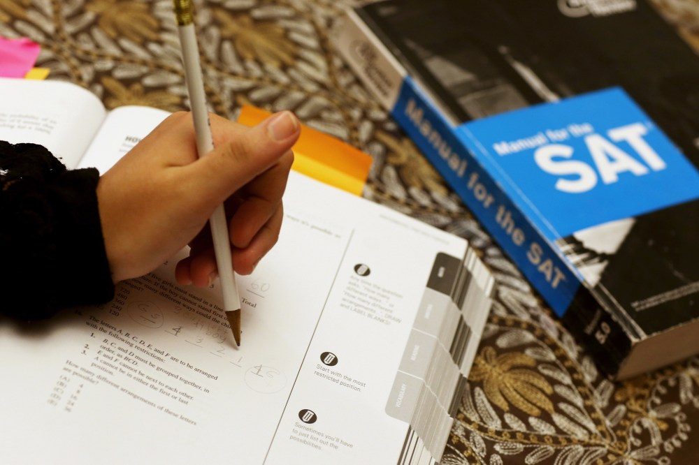 A student uses a Princeton Review SAT Preparation book to study for the test, March 6, 2014, in Pembroke Pines, Fla.