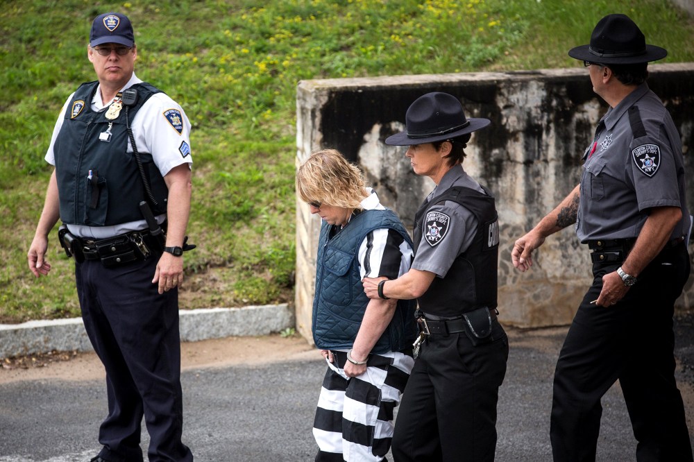 Joyce Mitchell, a prison worker who allegedly helped two convicts escape from prison, is lead from Plattsburgh Ciy Court after a hearing on June 15, 2015 in Plattsburgh, N.Y. (Photo by Andrew Burton/Getty)
