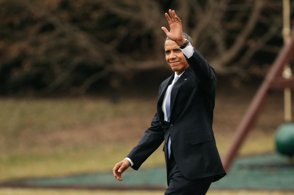 President Obama waves to guests as he walks across the South Lawn, March 11, 2014.