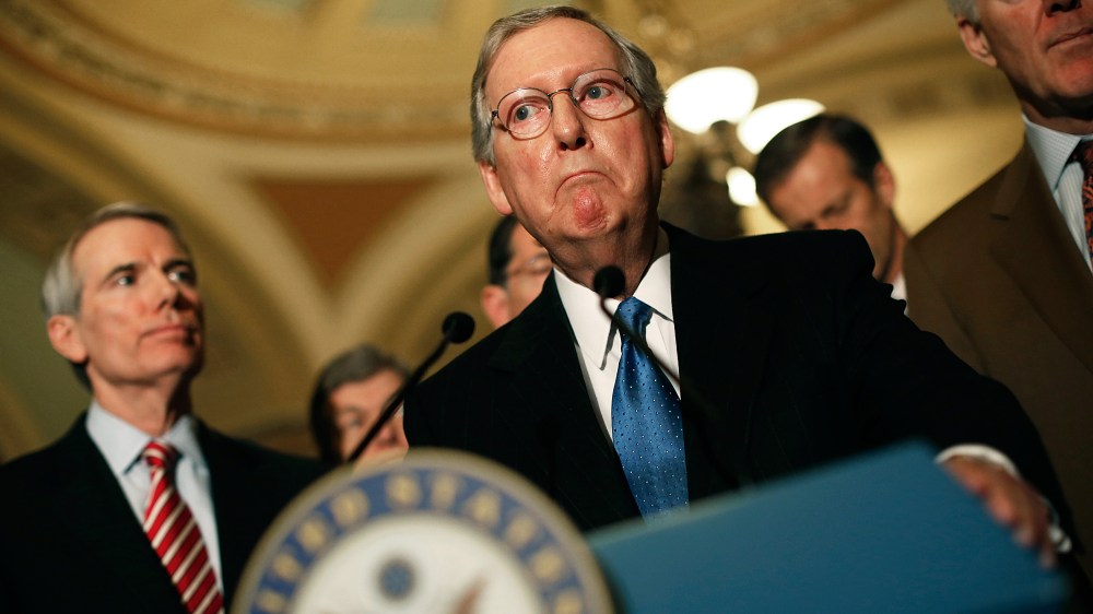 Sen. Mitch McConnell (C) (R-KY) answers questions following a weekly policy luncheon at the U.S. Capitol on March 11, 2014 in Washington, DC