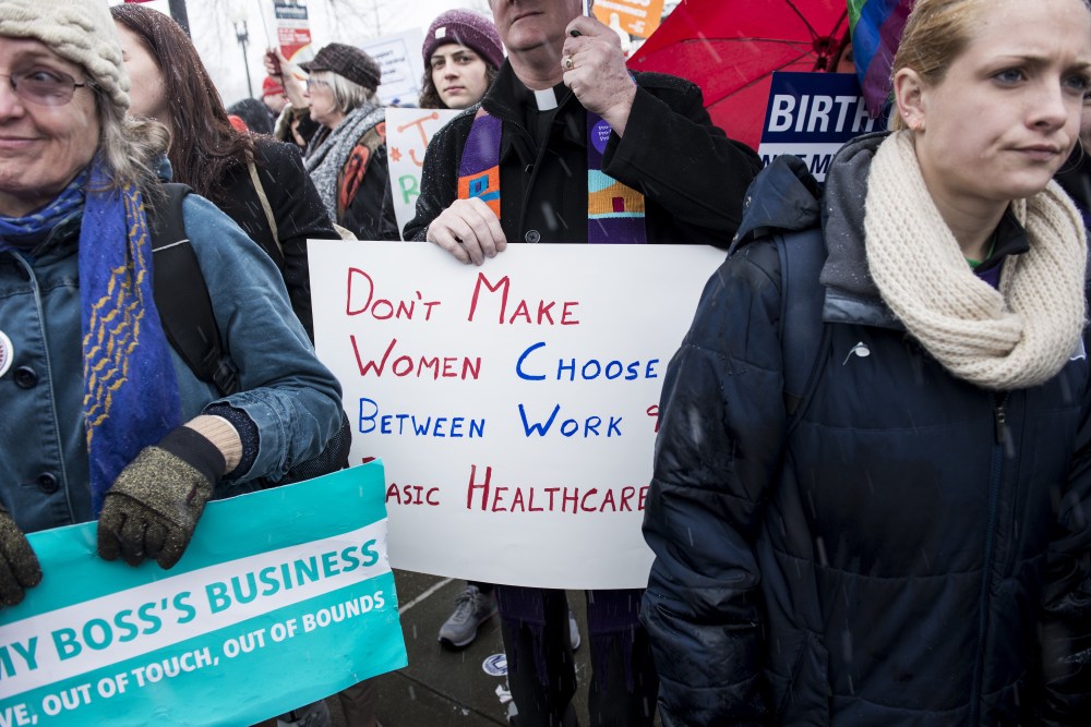 Activists rally outside the Supreme Court March 25, 2014 in Washington, DC.