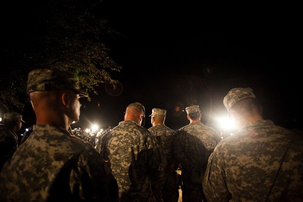 Soldiers watch during a press conference about a shooting that occurred earlier in the day at Fort Hood Military Base on April 2, 2014.